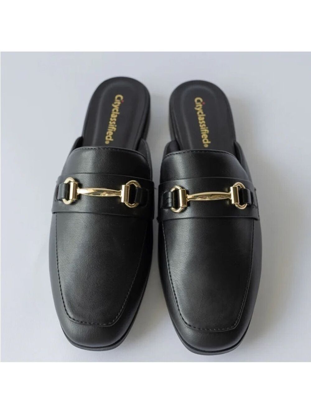 Cityclassified Slip-On Mules with Gold Buckles in Black Faux Leather